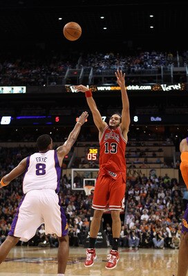 PHOENIX - NOVEMBER 24:  Joakim Noah #13 of the Chicago Bulls puts up a shot during the NBA game against the Phoenix Suns at US Airways Center on November 24, 2010 in Phoenix, Arizona. The Bulls defeated the Suns 123-115 in double overtime.  NOTE TO USER: