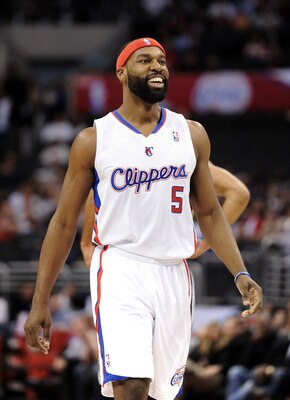LOS ANGELES, CA - DECEMBER 01:  Baron Davis #5 of the Los Angeles Clippers celebrates his pass for a score against the the San Antonio Spurs at the Staples Center on December 1, 2010 in Los Angeles, California.  NOTE TO USER: User expressly acknowledges a