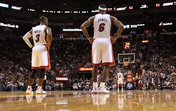 MIAMI - NOVEMBER 19:  Dwyane Wade #3 and LeBron James #6 of the Miami Heat look on during a game against the Charlotte Bobcats at American Airlines Arena on November 19, 2010 in Miami, Florida. NOTE TO USER: User expressly acknowledges and agrees that, by