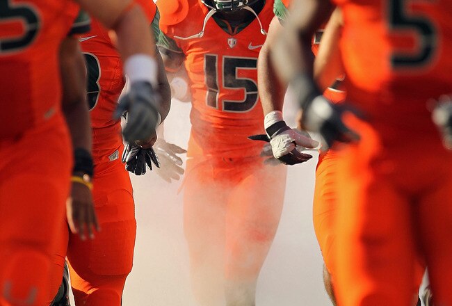 MIAMI - NOVEMBER 20: Jamal Reid #15 of the Miami Hurricanes runs out of the tunnel during a game against the Virginia Tech Hokies at Sun Life Stadium on November 20, 2010 in Miami, Florida.  (Photo by Mike Ehrmann/Getty Images)