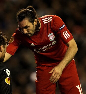 LIVERPOOL, ENGLAND - NOVEMBER 04:   Morgan De Sanctis of Napoli is consoled by Sotiros Kyrgiakos of Liverpool during the UEFA Europa League Group K match beteween Liverpool and SSC Napoli at Anfield on November 4, 2010 in Liverpool, England.  (Photo by Cl