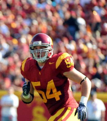 LOS ANGELES, CA - NOVEMBER 14:  Owen Marecic #48 of the Stanford Cardinal makes a catch in front of Chris Galippo #54 of the USC Trojans during the first half at the Los Angeles Memorial Coliseum on November 14, 2009 in Los Angeles, California.  (Photo by