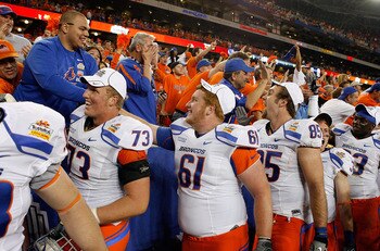 GLENDALE, AZ - JANUARY 04:  Nate Potter #73, Joe Kellogg #61 and Tommy Gallarda #85 of the Boise State Broncos and other teammates shake hands with their fans after their 17-10 victory against the TCU Horned Frogs during the Tostitos Fiesta Bowl at the Un