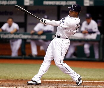 ST. PETERSBURG - AUGUST 17:  Outfielder Carl Crawford #13 of the Tampa Bay Rays fouls off a pitch against the Texas Rangers during the game at Tropicana Field on August 17, 2010 in St. Petersburg, Florida.  (Photo by J. Meric/Getty Images)