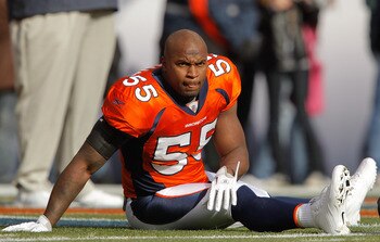 DENVER - NOVEMBER 14:  Linebacker D.J. Williams #55 of the Denver Broncos stretches up before taking on the Kansas City Chiefs at INVESCO Field at Mile High on November 14, 2010 in Denver, Colorado. Williams was arrested early Friday morning on suspicion