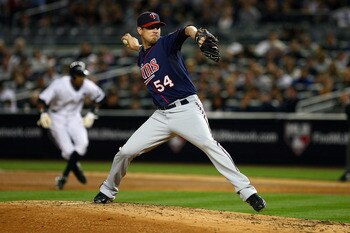 NEW YORK - OCTOBER 09:  Matt Guerrier #54 of the Minnesota Twins throws a pitch against the New York Yankees during Game Three of the ALDS part of the 2010 MLB Playoffs at Yankee Stadium on October 9, 2010 in the Bronx borough of New York City.  (Photo by