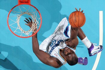 NEW ORLEANS - NOVEMBER 28:  Emeka Okafor #50 of the New Orleans Hornets makes a layup during the game against the San Antonio Spurs at the New Orleans Arena on November 28, 2010 in New Orleans, Louisiana.  NOTE TO USER: User expressly acknowledges and agr