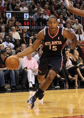 MIAMI, FL - DECEMBER 04:  Al Horford #15 of the Atlanta Hawks drives to the basket during a game against the Miami Heat at American Airlines Arena on December 4, 2010 in Miami, Florida. NOTE TO USER: User expressly acknowledges and agrees that, by downloa