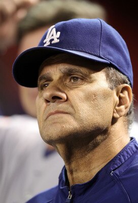 PHOENIX - SEPTEMBER 24:  Manager Joe Torre of the Los Angeles Dodgers watches from the dugout during the Major League Baseball game against the Arizona Diamondbacks at Chase Field on September 24, 2010 in Phoenix, Arizona.  (Photo by Christian Petersen/Ge