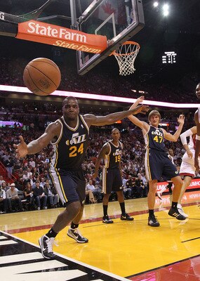 MIAMI - NOVEMBER 09:  Paul Millsap #24 of the Utah Jazz tries to stop a ball from going out of bounds during a game against the Miami Heat at American Airlines Arena on November 9, 2010 in Miami, Florida. NOTE TO USER: User expressly acknowledges and agre