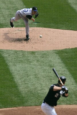 CHICAGO - MAY 5:  Starting pitcher Zack Greinke #23 of the Kansas City Royals delivers the ball to Joe Crede #24 of the Chicago White Sox May 5, 2005 at U.S. Cellular Field in Chicago, Illinois. The White Sox defeated the Royals 2-1.  (Photo by Jonathan D