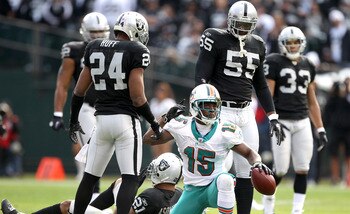 OAKLAND, CA - NOVEMBER 28:  Davone Bess #15 of the Miami Dolphins motions for a first down after he caught a pass during their game against the Oakland Raiders at Oakland-Alameda County Coliseum on November 28, 2010 in Oakland, California.  (Photo by Ezra