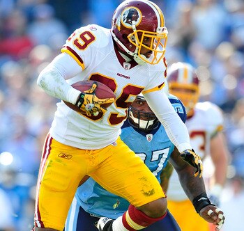 NASHVILLE, TN - NOVEMBER 21:  Santana Moss #89 of the Washington Redskins makes a catch under pressure from Tony Brown #97 of the Tennessee Titans during the first half at LP Field on November 21, 2010 in Nashville, Tennessee.  (Photo by Grant Halverson/G