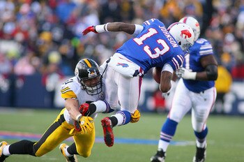 ORCHARD PARK, NY - NOVEMBER 28:  Steve Johnson #13 of the Buffalo Bills is tackled James Farrior #51 of the Pittsburgh Steelers at Ralph Wilson Stadium at Ralph Wilson Stadium on November 28, 2010 in Orchard Park, New York.Pittsburgh won 19-16 in overtime