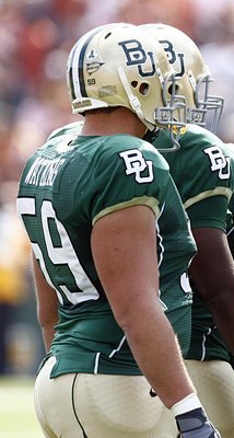 WACO, TX - NOVEMBER 14: Quarterback Nick Florence #11 of the Baylor Bears leads his team in the huddle against the Texas Longhorns in the second half on November 14, 2009 at Floyd Casey Stadium in Waco, Texas. (Photo by Tom Pennington/Getty Images)
