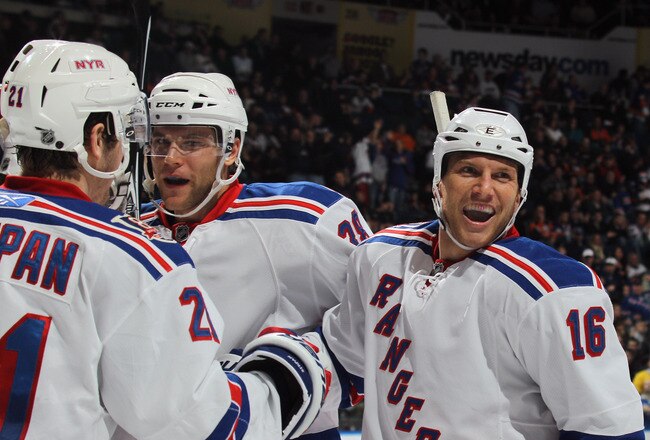 UNIONDALE, NY - DECEMBER 02: Sean Avery #16 of the New York Rangers celebrates a third period goal by Marian Gaborik #10 against the New York Islanders at the Nassau Coliseum on December 2, 2010 in Uniondale, New York. The Rangers defeated the Islanders 6