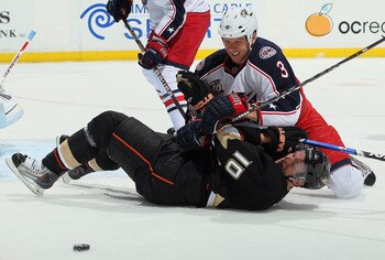 ANAHEIM, CA - NOVEMBER 19:  Marc Methot #3 of the Columbus Blue Jackets and Corey Perry #10 of the Anaheim Ducks get tangled up during the first period at the Honda Center on November 19, 2010 in Anaheim, California.  (Photo by Jeff Gross/Getty Images)