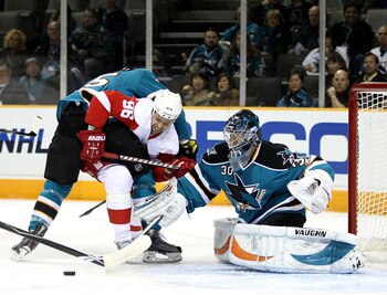 SAN JOSE, CA - NOVEMBER 30:  Tomas Holmstrom #96 of the Detroit Red Wings tries to score on Derek Joslin #65 of the San Jose Sharks and Antero Niittymaki #30 of the San Jose Sharks at HP Pavilion on November 30, 2010 in San Jose, California.  (Photo by Ez