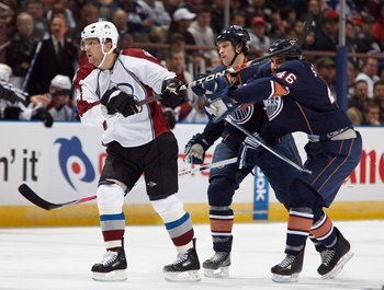EDMONTON, CANADA - NOVEMBER 15:  Ruslan Salei #24 of the Colorado Avalanche tangles with Zach Stortini #46 of the Edmonton Oilers during their NHL game on November 15, 2008 at Rexall Place in Edmonton, Alberta, Canada. The Avalanche defeated the Oilers 3-
