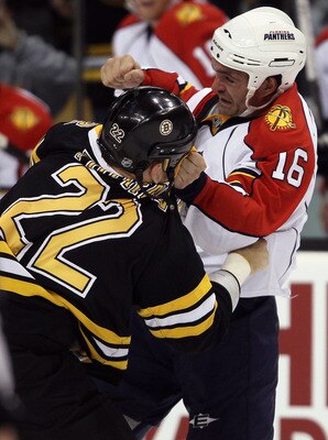 BOSTON - NOVEMBER 18:  Shawn Thornton #22 of the Boston Bruins and Darcy Hordichuk #16 of the Florida Panther exchange punches on November 18, 2010 at the TD Garden in Boston, Massachusetts.  (Photo by Elsa/Getty Images)