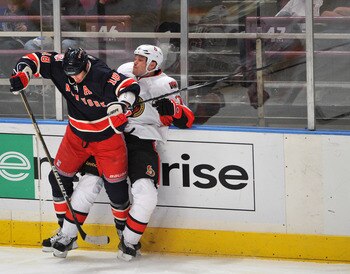 NEW YORK, NY - DECEMBER 5: Marc Staal #18 of the New York Rangers checks Jarkko Ruutu #73 of the Ottawa Senators during the third period at Madison Square Garden on December 5, 2010 in New York City. (Photo by Christopher Pasatieri/Getty Images)