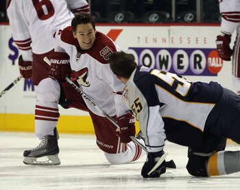 NASHVILLE, TN - NOVEMBER 30:  Shane O'Brien #55 of the Nashville Predators talks with former teammate Scottie Upshall #8 of the Phoenix Coyotes prior to their game at the Bridgestone Arena on November 30, 2010 in Nashville, Tennessee. The Predators defeat