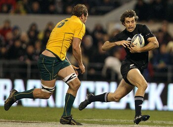 CHRISTCHURCH, NEW ZEALAND - AUGUST 07: Conrad Smith of the All Blacks attacks past Rocky Elsom of the Wallabies during the 2010 Tri-Nations Bledisloe Cup match between the Australian Wallabies and the New Zealand All Blacks at AMI Stadium on August 7, 201