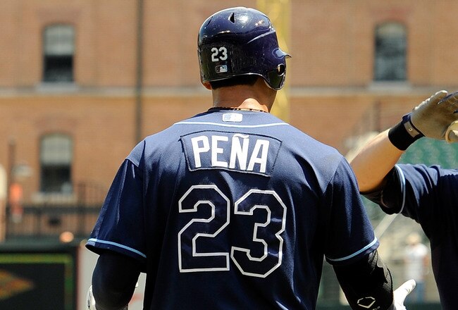 BALTIMORE - JULY 21:  Evan Longoria #3 of the Tampa Bay Rays is congratulated by Carlos Pena #23 after hitting a home run in the first inning against the Baltimore Orioles at Camden Yards on July 21, 2010 in Baltimore, Maryland.  (Photo by Greg Fiume/Gett