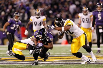 BALTIMORE, MD - DECEMBER 05:  Wide receiver Derrick Mason #85 of the Baltimore Ravens is tackled by safety Ryan Clark #25 of the Pittsburgh Steelers during the second quarter of the game at M&T Bank Stadium on December 5, 2010 in Baltimore, Maryland. Pitt