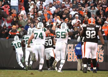 CLEVELAND - NOVEMBER 14:  Wide receiver Santonio Holmes #10 of the New York Jets scores a touchdown in overtime against the Cleveland Browns at Cleveland Browns Stadium on November 14, 2010 in Cleveland, Ohio.  (Photo by Matt Sullivan/Getty Images)