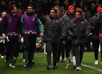 MANCHESTER, ENGLAND - OCTOBER 20:  Gary Neville and Javier Hernandez of Manchester United as he walk to the bench prior to the UEFA Champions League Group C  match between Manchester United and Bursaspor Kulubu at Old Trafford on October 20, 2010 in Manch
