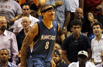 MIAMI - NOVEMBER 02:  Forward Michael Beasley #8 of the Minnesota Wolves walks off the court injured against the Miami Heat at American Airlines Arena on November 2, 2010 in Miami, Florida. NOTE TO USER: User expressly acknowledges and agrees that, by dow