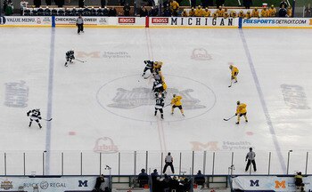 ANN ARBOR, MI - DECEMBER 11:  Michigan State Spartans and the Michigan Wolverines face off at the start of the Big Chill game at Michigan Stadium on December 11, 2010 in Ann Arbor, Michigan.  (Photo by Leon Halip/Getty Images)