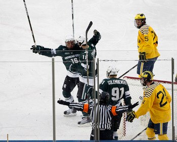 ANN ARBOR, MI - DECEMBER 11: Dean Chelios #16 of the Michigan State Spartans celebrates a second period goal that was waved off by the referee during the game against the Michigan Wolverines at the Big Chill game at Michigan Stadium on December 11, 2010 i