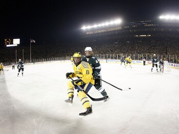 ANN ARBOR, MI - DECEMBER 11:  Torey Krug #44 of the Michigan State Spartans checks Jacob Fallon #8 of the Michigan Wolverines at Michigan Stadium on December 11, 2010 in Ann Arbor, Michigan.  (Photo by Gregory Shamus/Getty Images)