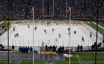 ANN ARBOR, MI - DECEMBER 11:  Michigan State Spartans and the Michigan Wolverines battle during second period of the Big Chill game at Michigan Stadium on December 11, 2010 in Ann Arbor, Michigan.  (Photo by Leon Halip/Getty Images)