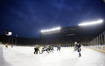 ANN ARBOR, MI - DECEMBER 11: A third period faceoff takes place between the Michigan Wolverines and Michigan State Spartans during thier outdoor game at Michigan Stadium on December 11, 2010 in Ann Arbor, Michigan.  (Photo by Gregory Shamus/Getty Images)