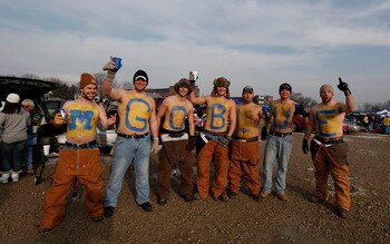 ANN ARBOR, MI - DECEMBER 11: Michigan fans gets ready for the start of the game between the Michigan State Spartans and Michigan Wolverines at the Big Chill game at Michigan Stadium on December 11, 2010 in Ann Arbor, Michigan.  (Photo by Leon Halip/Getty