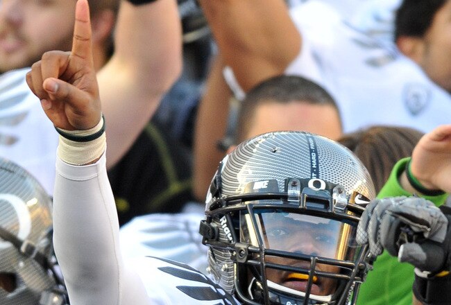 CORVALLIS, OR - DECEMBER 4: Quarterback Darron Thomas #1 of the Oregon Ducks signals to the fans in the stands after the game at Reser Stadium on December 4, 2010 in Corvallis, Oregon. he Ducks beat the Beavers 37-20 to likely go on the BCS Championship g
