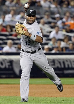 NEW YORK - AUGUST 03:  Edwin Encarnacion #12 of the Toronto Blue Jays in action against of the New York Yankees on August 3, 2010 at Yankee Stadium in the Bronx borough of New York City. The Jays defeated the Yankees 8-2.  (Photo by Jim McIsaac/Getty Imag