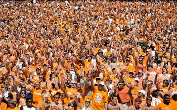 KNOXVILLE, TN - SEPTEMBER 18:  Orange-clad Tennessee Volunteers fans sing along with 'Rocky Top' during a game against the Florida Gators at Neyland Stadium on September 18, 2010 in Knoxville, Tennessee. Florida won 31-17.  (Photo by Grant Halverson/Getty