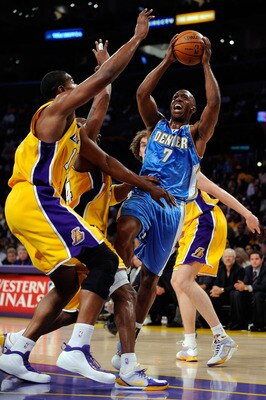 LOS ANGELES, CA - MAY 21:  Chauncey Billups #7 of the Denver Nuggets goes up for a shot over Andrew Bynum #17 and Kobe Bryant #24 of the Los Angeles Lakers in the first half in Game Two of the Western Conference Finals during the 2009 NBA Playoffs at Stap