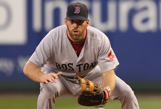 SEATTLE - JULY 23: Kevin Youkilis #20 of the Boston Red Sox fields a ground ball by Milton Bradley of the Seattle Mariners at Safeco Field on July 23, 2010 in Seattle, Washington. (Photo by Otto Greule Jr/Getty Images)