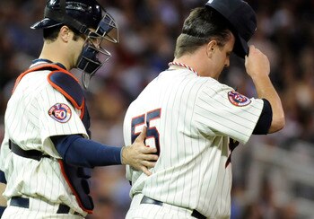 MINNEAPOLIS, MN - OCTOBER 7: Joe Mauer #7 and Matt Capps #55 of the Minnesota Twins speak on the mound in the ninth inning during game two of the ALDS game against the New York Yankees on October 7, 2010 at Target Field in Minneapolis, Minnesota. (Photo b