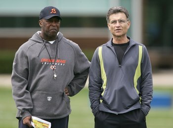 LAKE FOREST, IL - MAY 4: The head coach Lovie Smith (L)  and general manager Jerry Angelo of the Chicago Bears look over players  during a rookie mini-camp practice at Halas Hall May 4, 2007 in Lake  Forest, Illinois. (Photo by Jonathan Daniel/Getty Images)