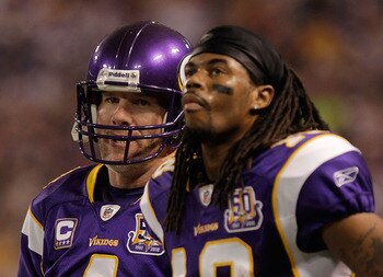 MINNEAPOLIS, MN - DECEMBER 05:  Brett Favre #4 of the  Minnesota Vikings talks with Sidney Rice #18 on the sideline during the  game against the Buffalo Bills at the Mall of America Field at the  Hubert H. Humphrey Metrodome on December 5, 2010 in Minneapoli