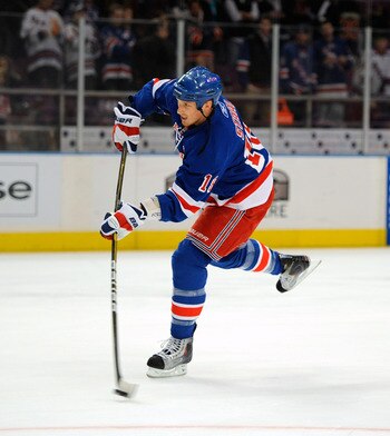 NEW YORK - NOVEMBER 22:  Marc Staal  #18 of the New York Rangers shoots the puck during warmups before a game against the Calgary Flames on November 22, 2010 at Madison Square Garden in New York City.  (Photo by Lou Capozzola/Getty Images)
