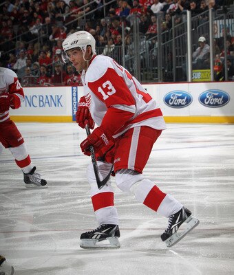 NEWARK, NJ - DECEMBER 11:  Pavel Datsyuk #13 of the Detroit Red Wings skates against the New Jersey Devils at the Prudential Center on December 11, 2010 in Newark, New Jersey. The Red Wings defeated the the Devils 4-1.  (Photo by Bruce Bennett/Getty Image