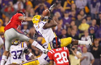 BATON ROUGE, LA - NOVEMBER 20:  Patrick Peterson #7 of the Louisiana State University Tigers nearly intercepts a pass in the final seconds against Markeith Summers #16 and Korvic Neat #28 of the Ole Miss Rebels as time expired at Tiger Stadium on November