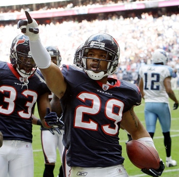 HOUSTON - NOVEMBER 28:  Cornerback Glover Quin #29 of the Houston Texans celebrates after intercepting a pass intended for wide receiver Justin Gage #12 of the Tennessee Titans at Reliant Stadium on November 28, 2010 in Houston, Texas.  (Photo by Bob Leve
